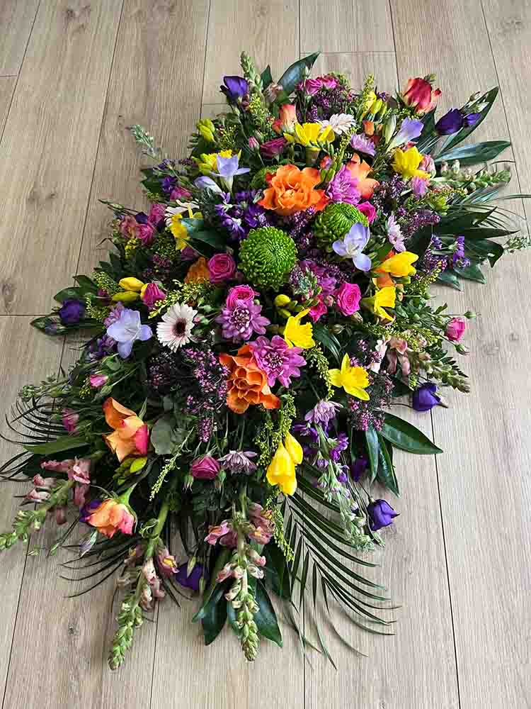 Multicoloured funeral flower spray