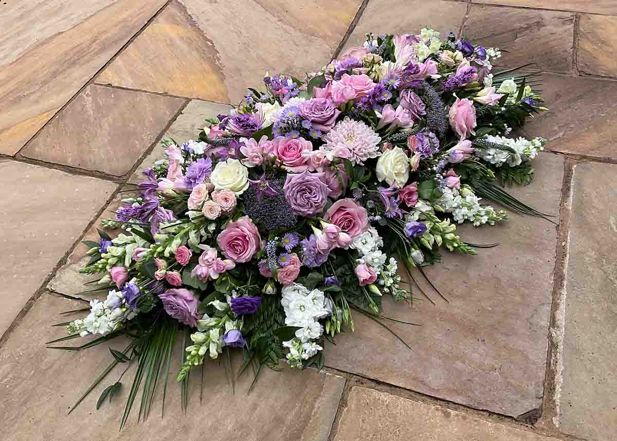 White and pink flowers arranged in a funeral spray