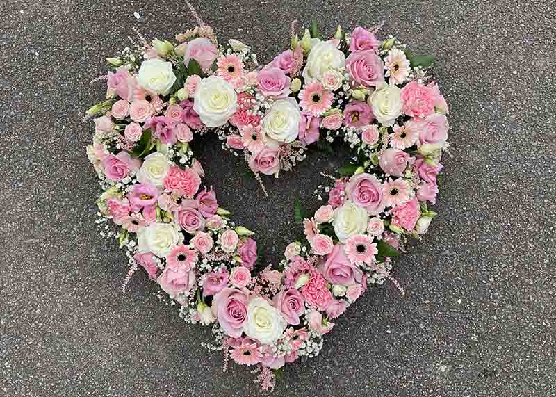 White and pink heart made from roses