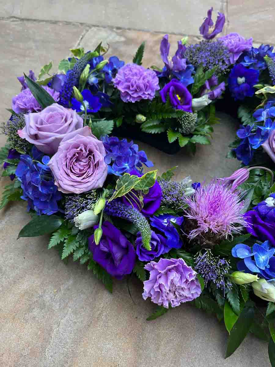Purple and green funeral flower heart