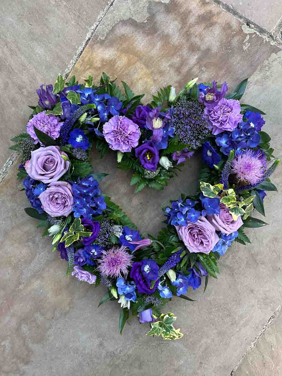 Purple and green funeral flower heart