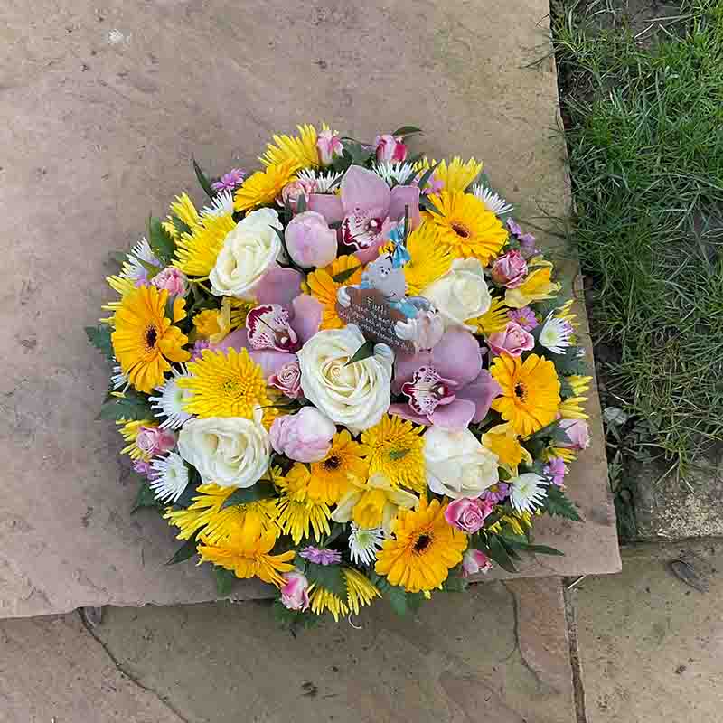 Yellow Pink & White Funeral Flower Pad with a Message in the center